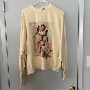 Selkie cherub pullover with zipper details. Size medium.